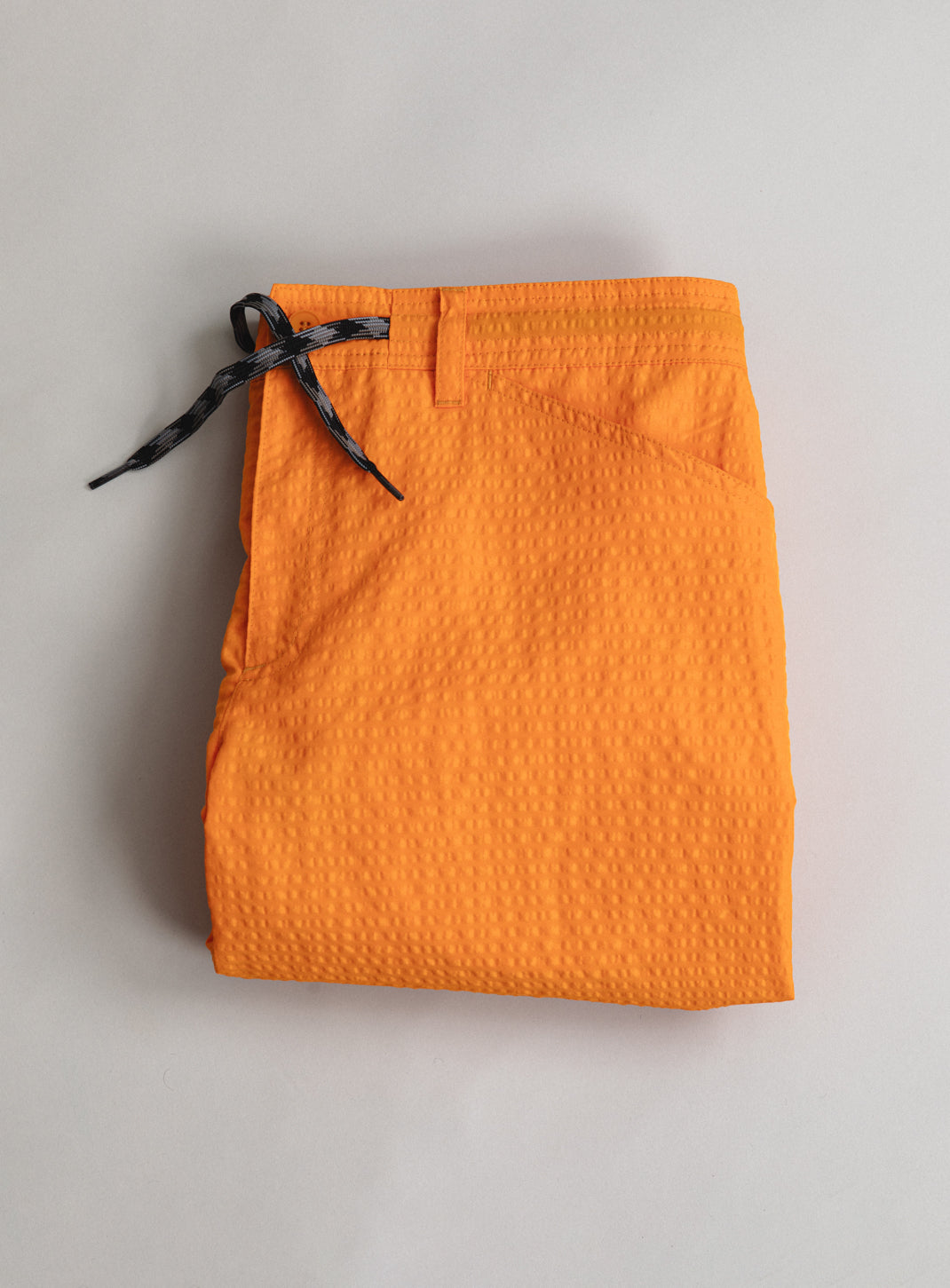 Running Shorts with Cargo Pocket in Orange Embossed Technical Fabric