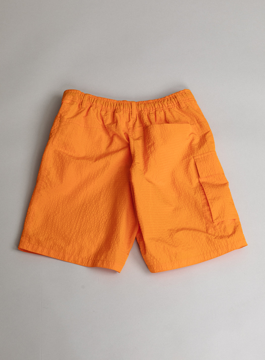 Short Running à Poche Cargo en Tissu Technique Gaufré Orange