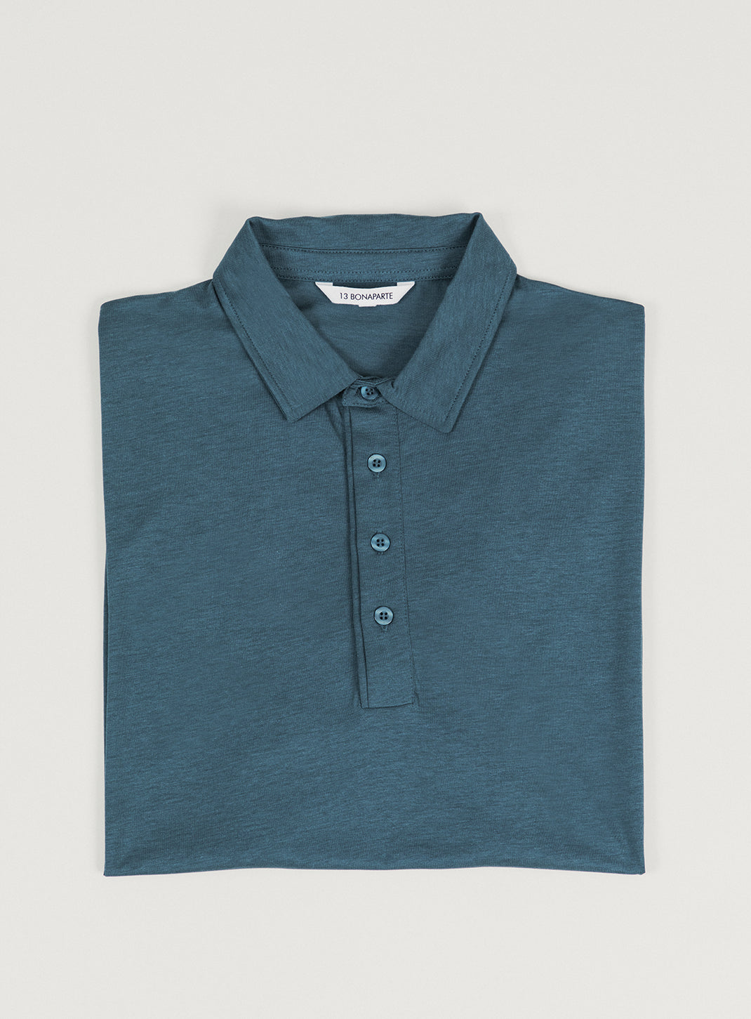 Pleated Tab Short Sleeve Poloshirt in Petrol Blue Eucalyptus & Cotton